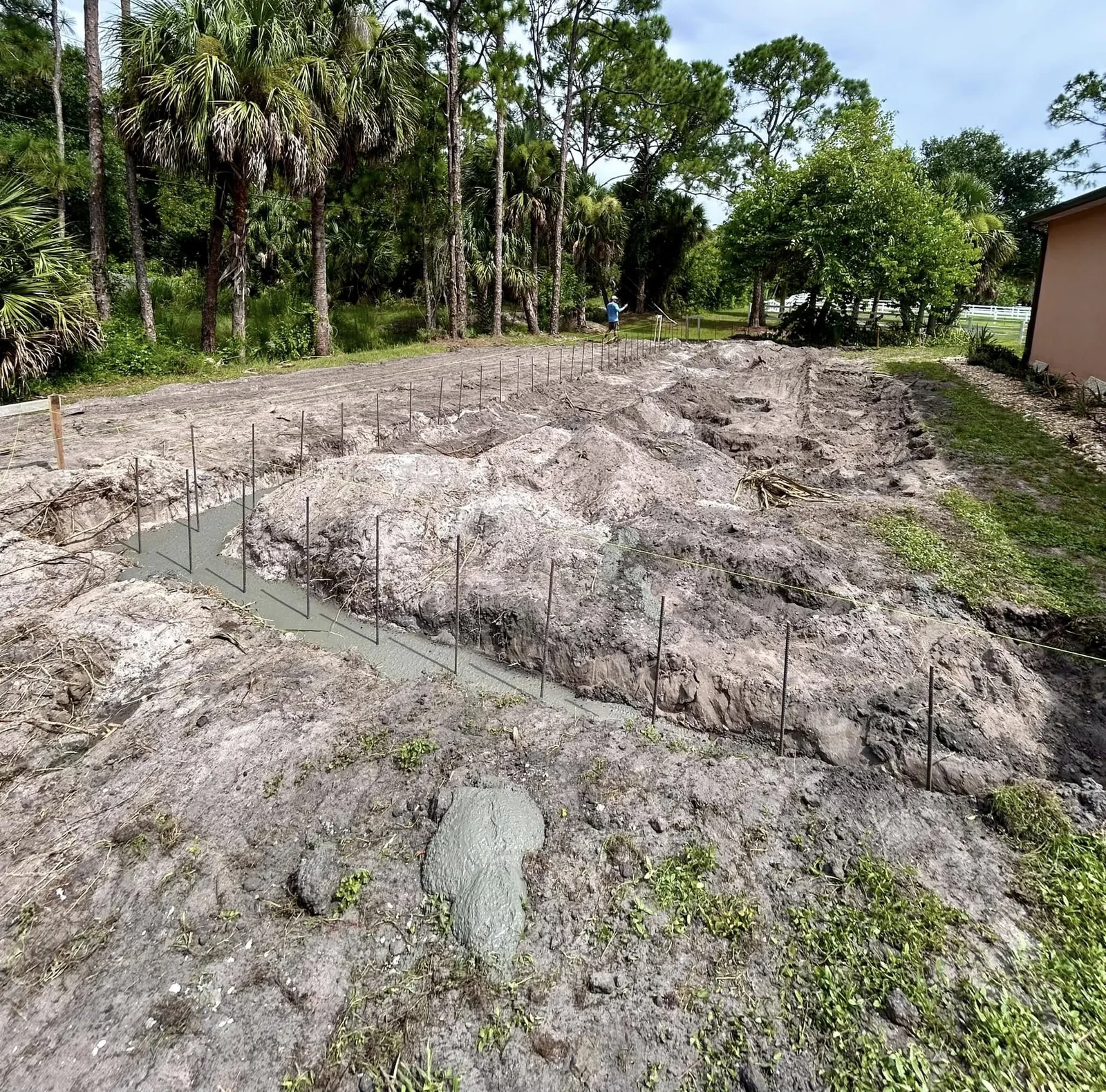 Concrete footings placed in excavated trenches for a JCD Concrete project