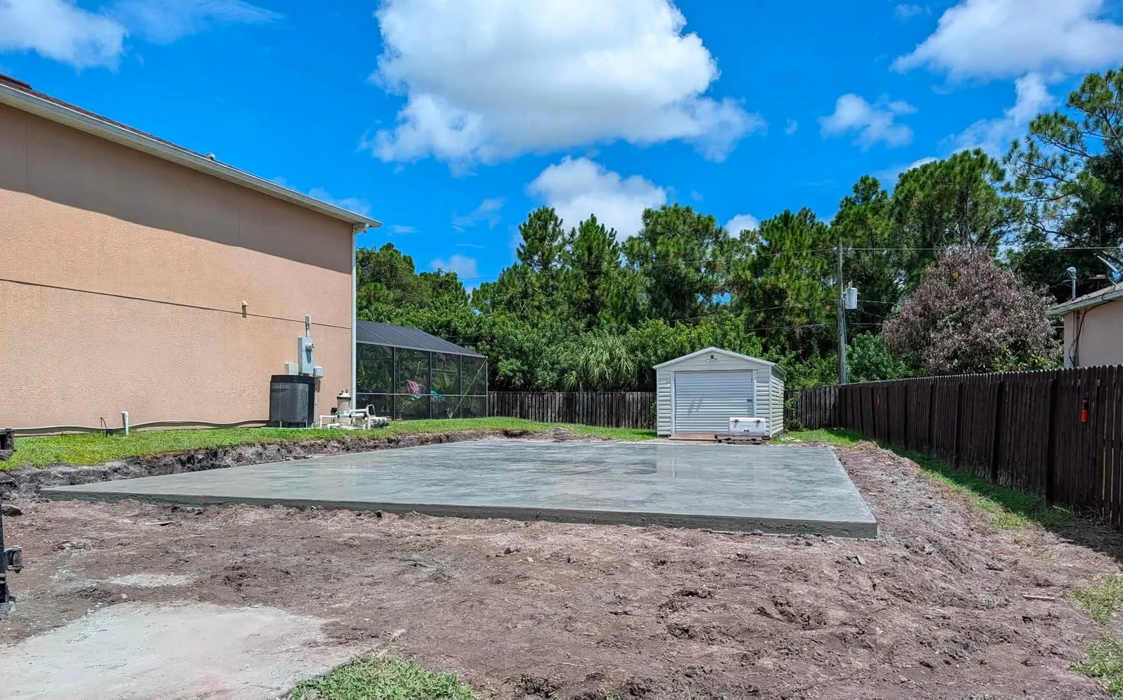 Finished concrete slab installed in a residential yard by JCD Concrete