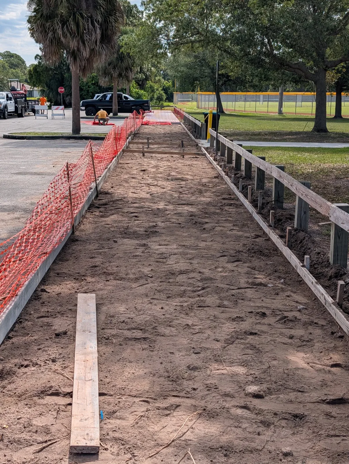 JCD crew forming a long concrete sidewalk route at Liberty Park in Palm Bay