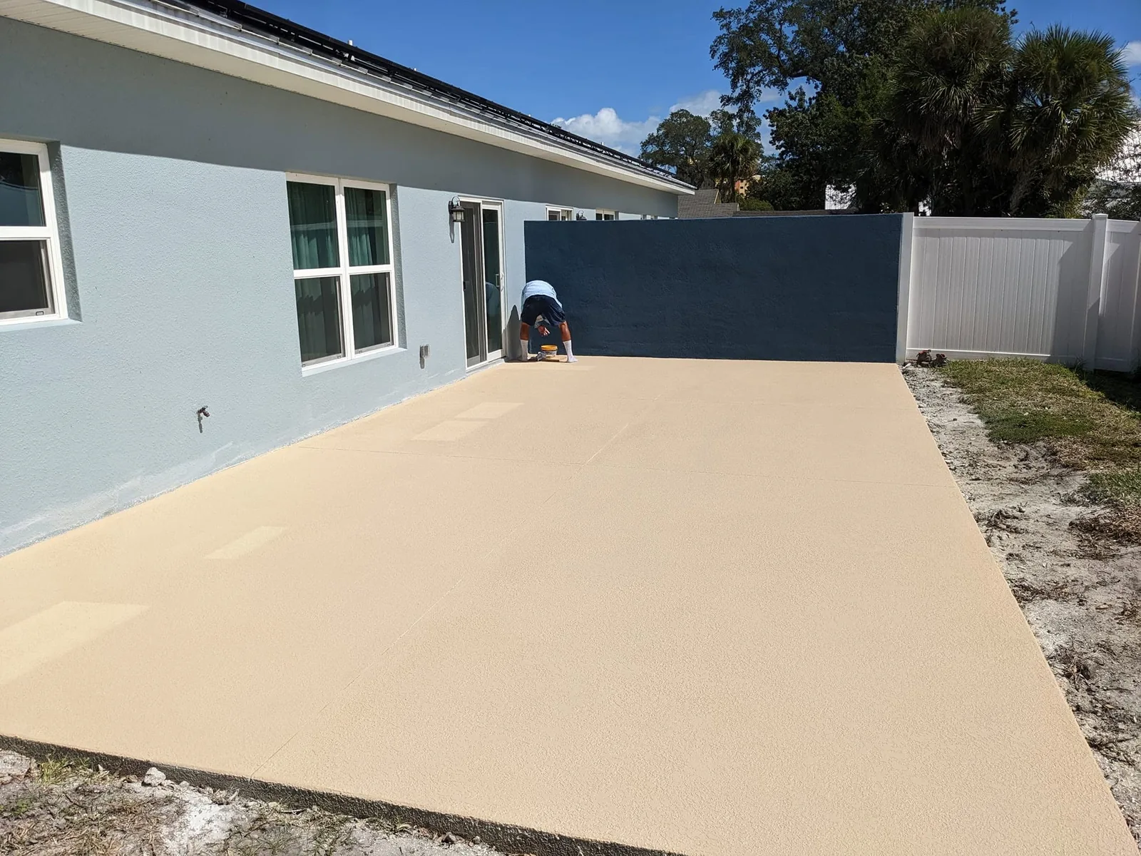 Completed tan spray-deck finish on a residential outdoor concrete surface by JCD Concrete